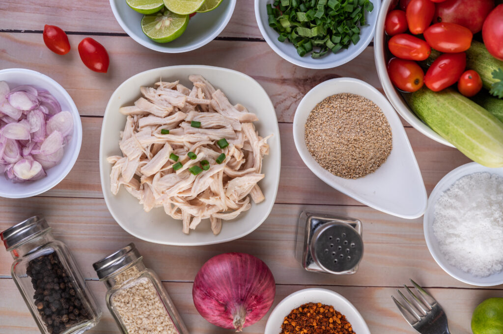Ingredients for creamy leftover turkey noodle soup prepped on a counter.