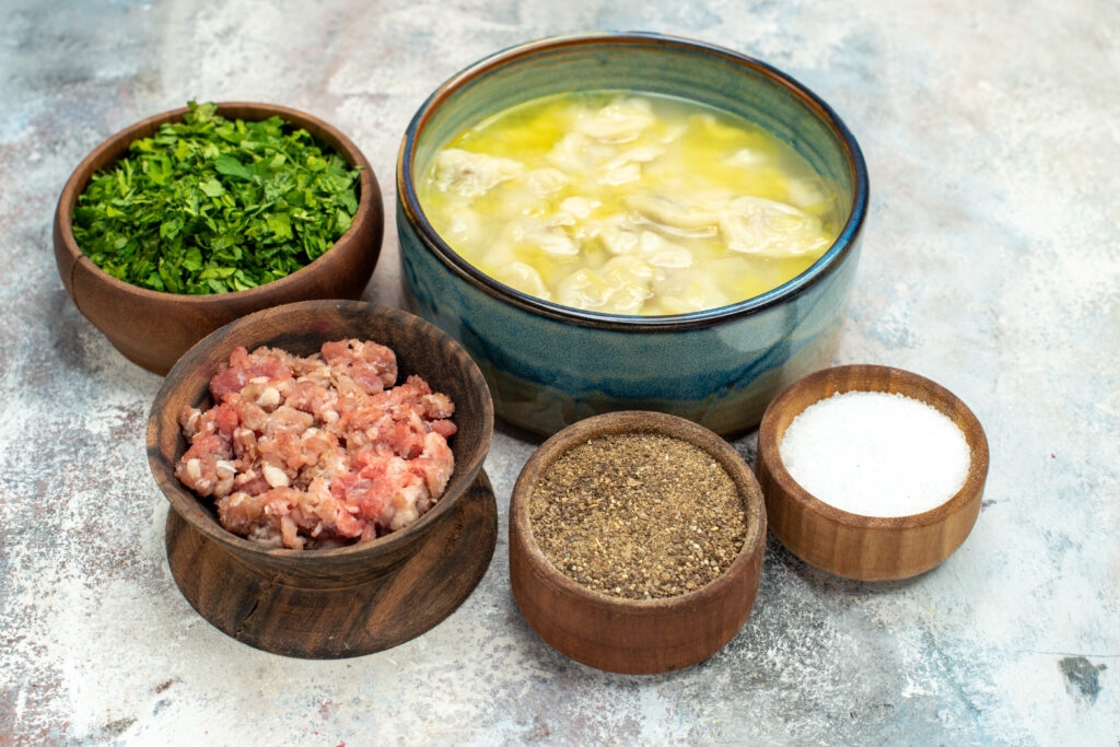 Turkey soup simmering in a crockpot before the creamy element is . 